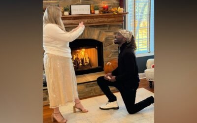 The family celebrates the second Thanksgiving dinner with the mailman who came to the father's aid