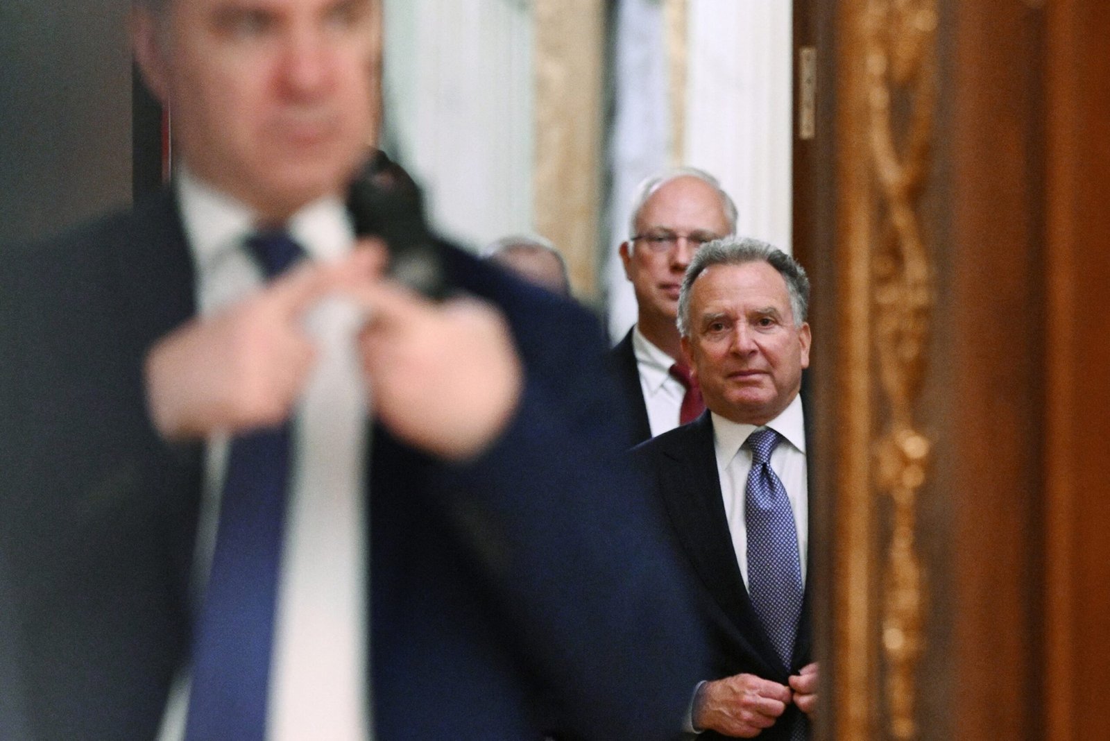 PHOTO: In this collective photograph distributed by the Russian state agency Sputnik, Steve Witkoff, accompanied by the Kremlin's economic envoy, Kirill Dmitriev, is seen before a meeting with the president of Russia at the Kremlin in Moscow on December 2, 2025.